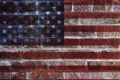 Especially if the flags you have got, have brass eyelets for tying them to a flagpole. USA Flag on Brick Wall Background Photograph by Jit Lim