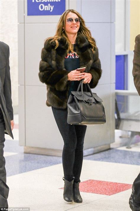 Liz Hurley Looks Chic In A Fur Coat As She Touches Down In New York