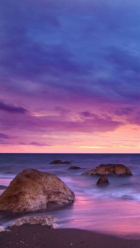 1080x1920 Seashore Sunset Ocean Water Rocks Beach Hd 5k For