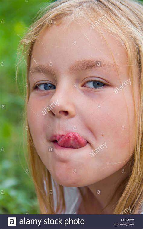 Cute Girl Put Out Tongue High Resolution Stock Photography
