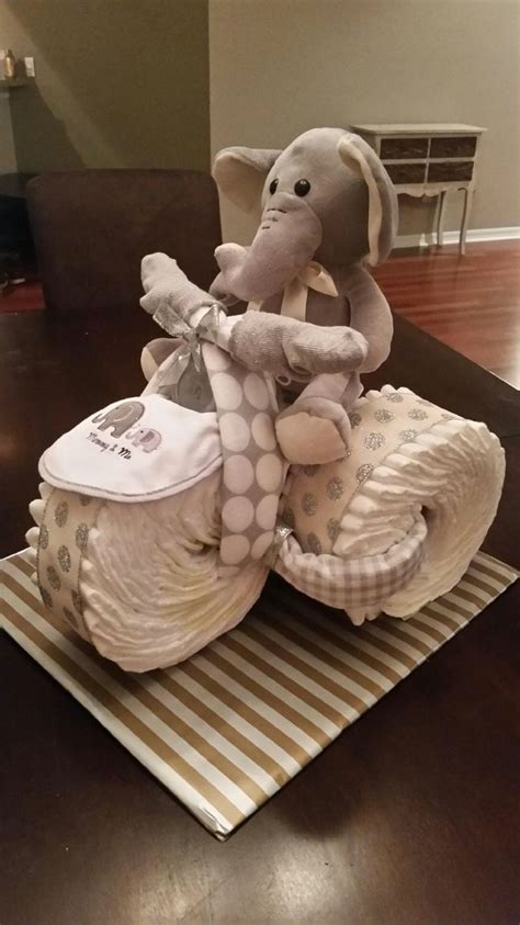 No source found via pinterest Elephant Tricycle Diaper Cake | Elephant baby shower theme ...