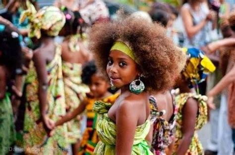 Afro-Costa Rican girl wearing her ancestral African dress celebrates