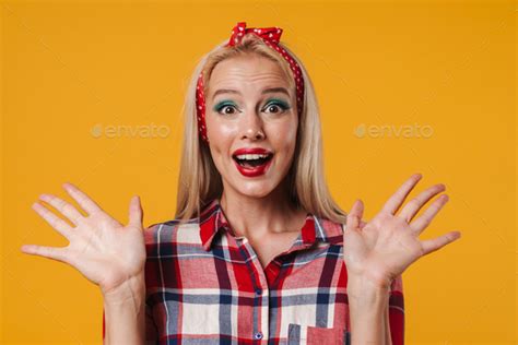 Image Of Excited Blonde Pinup Girl Expressing Surprise At Camera Stock