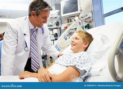 Boy Talking To Male Doctor In Emergency Room Stock Photo Image Of