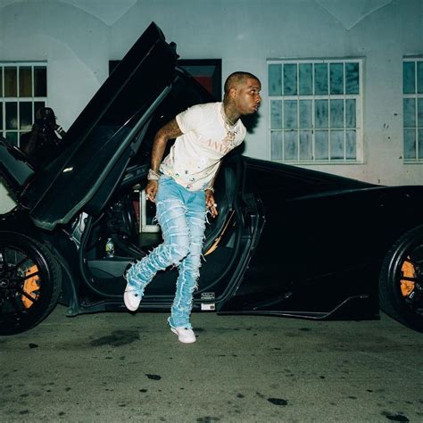 Tory Lanez Continues To Pose Sitting On His Cars This Time On His