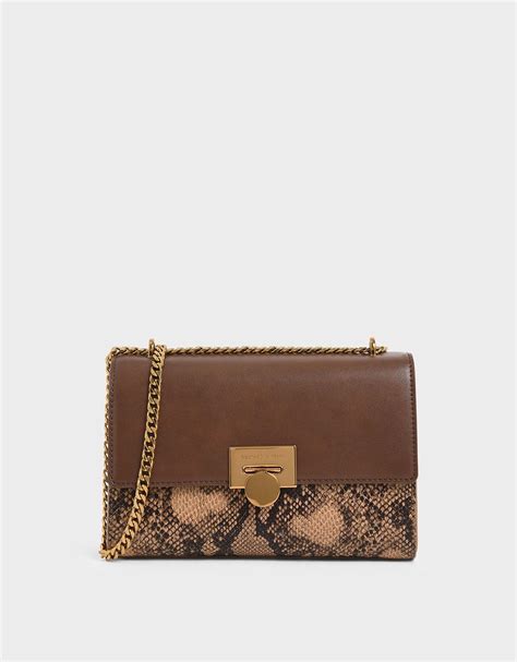 Charles And Keith Snake Print Chain Strap Clutch In Brown Lyst