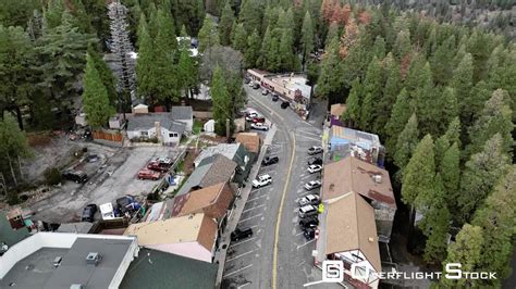 Overflightstock Small Town In The Forested Mountains Drone Aerial