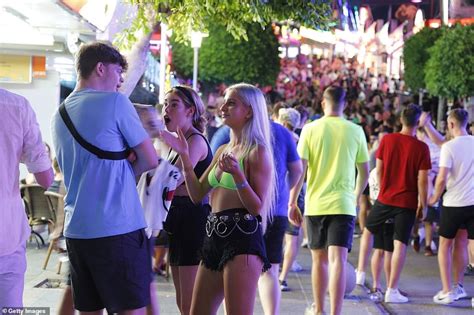 boozed up british revellers take to magaluf s main strip as they party the night away daily