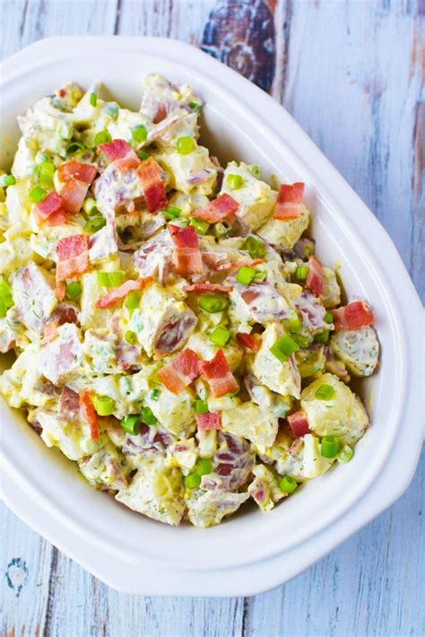 Tender potatoes and hard boiled eggs make this traditional potato salad the best basic potato salad recipe around! Red Potato Salad Recipe with Homemade Dill Dressing and Bacon Pieces | #sidedish #potatoes #h ...