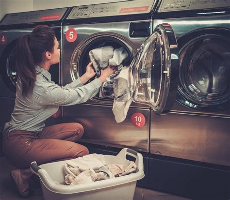 Beautiful Woman Doing Laundry At Laundromat Shop T L EQUIPMENT SALES CO INC Commercial
