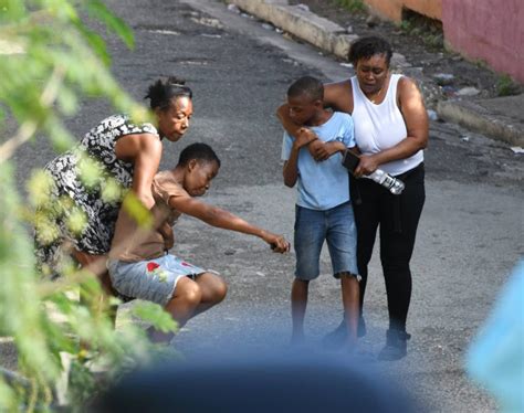Frustrated Jamaican Mom Kicks Sons Corpse After Police Shootout