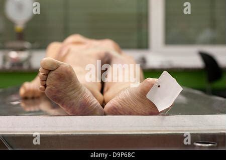 A Dead Woman Lies On A Table Of The Depanrtmend For Forensic Stock