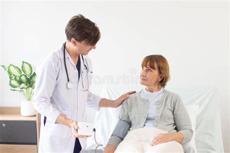 The Doctor Is Examining The Patient In The Hospital Stock Image
