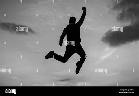 Man Jump High Silhouette Full Of Energy Against Sunset Sky Energy