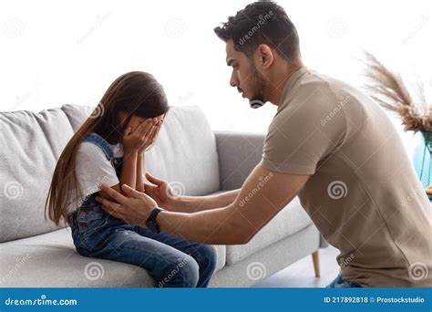 Little Girl Crying Upset Young Father Consoling Daughter Stock Photo