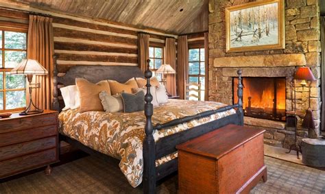 A beautiful view of snowy conifers out the window make the space feel even more warm and comfortable. How To Design A Rustic Bedroom That Draws You In