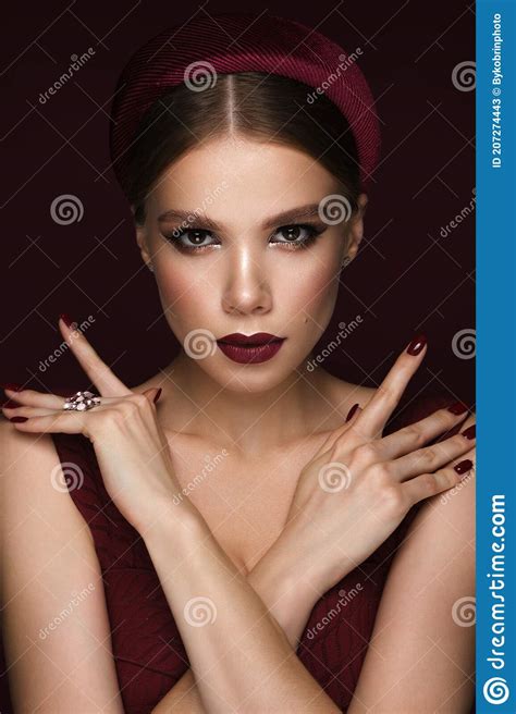 beautiful woman with classic make up fashion hair and red lips beauty face photo taken in the