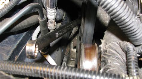 The Original Mechanic Replacing The Serpentine Belt On A 30l Dodge