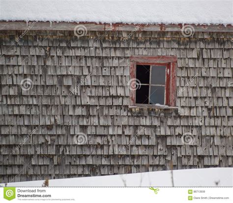 Old Weathered Cedar Shakes Shingles Barn With Red Window Winter Stock