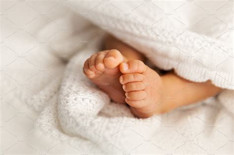 Newborn Baby Feet Under Blanket People Images ~ Creative Market