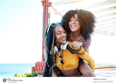 Cheerful Girlfriends Having Fun In Summer Day A Royalty Free Stock