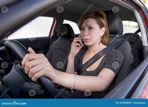 Worried And Stressed Woman Driving Car While Talking On The Mobile