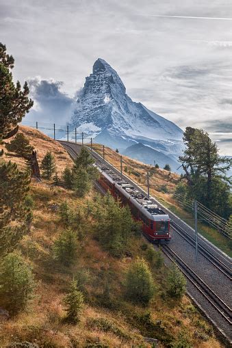 Matterhorn Peak With A Train Against Sunset In Swiss Alps Switzerland