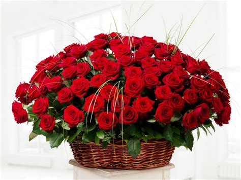 Big Bouquet Of Beautiful Red Roses In A Basket On A White