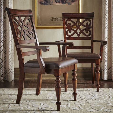 The colorful dining chairs can set the tone in your dining room for a lavish dinner. Leopoldo Armed Upholstered Dining Chair in 2020 | Dining ...