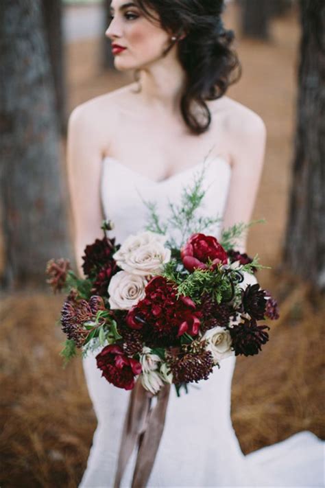 Bridal bouquet of red roses, with red satin ribbons. 35 Amazing Winter Wedding Bouquets You'll Love | Deer ...
