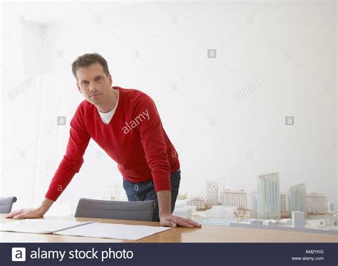Businessman Leaning Over Office Chair Stock Photos And Businessman