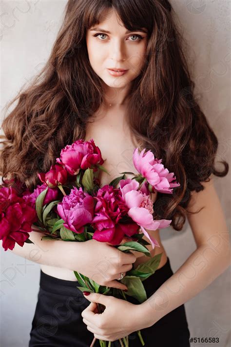 A Beautiful Woman Topless With Long Hair And A Bouquet Stock Photo