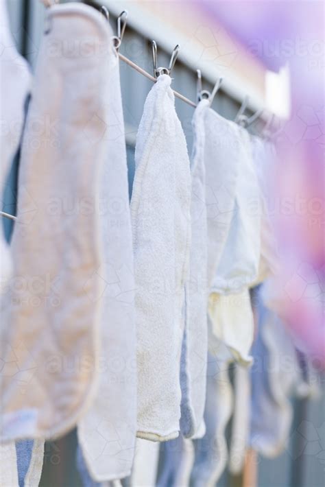 Image Of Cloth Nappy Inserts Hanging On Washing Line With