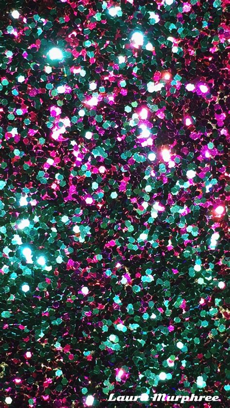 An Image Of Colorful Glitter In The Dark