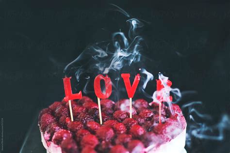 Red Burning Love Candles Over Heart Shapped Cake Del Colaborador De Stocksy Jovana Rikalo