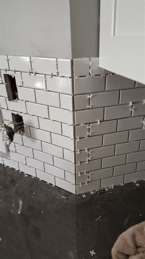 We installed the backsplash tile over two days. Tiling Outside Corners Without Bullnose | Shapeyourminds.com