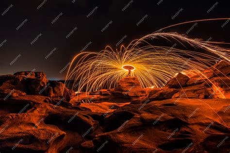 Premium Photo Burning Steel Wool On The Rock Near The River At Sam