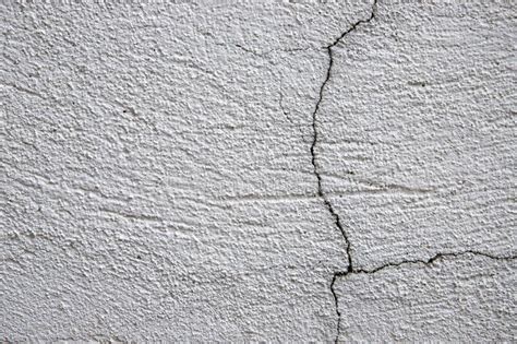 White Plaster Painted Wall With Grit And Cracks Cracked Wall Closeup