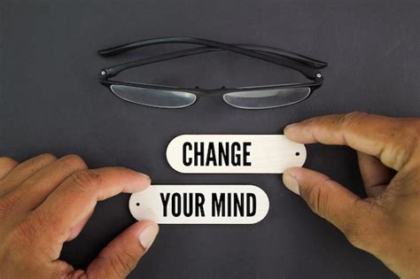 Premium Photo A Pair Of Glasses Are Next To A Person Holding A Change