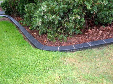 After you have laid out all the stakes, lay a line of bricks along the path you want the edging to follow. 23 Types of Lawn Edge Styles, Materials & Options
