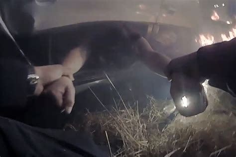 Police Officer Rescues Woman From Burning Car In Dramatic Bodycam Video