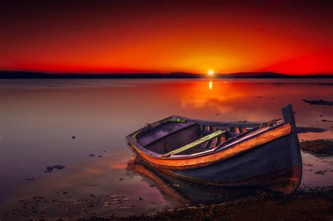 Docked boat on shoreline during golden hour HD wallpaper | Wallpaper Flare