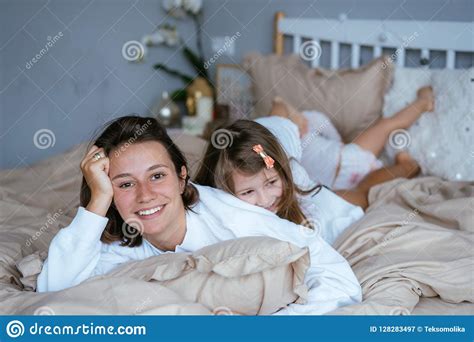 Mom And Her Two Little Cute Daughters Are Having Fun Stock Image