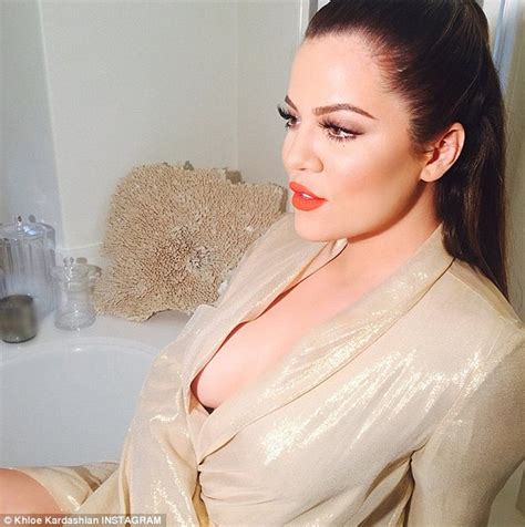 Khloe Kardashian Showcases Slim Legs In Golden Dressing Gown After