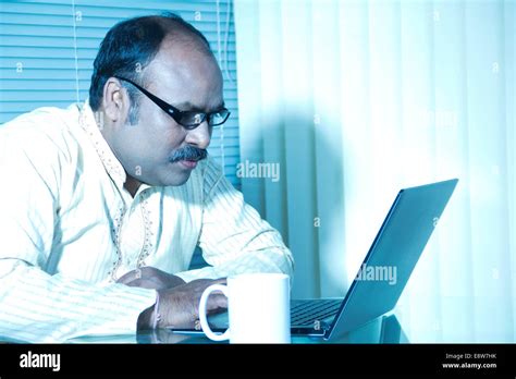 1 Indian Man Working In Office Stock Photo Alamy