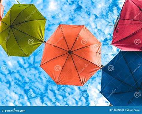 Colorful Umbrella With Clear Sky On Sunny Day Bottom View Stock Photo
