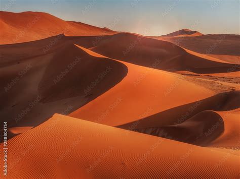 Sun Rising Over The Red Sand Dunes Of The Namib Desert Namibia Stock