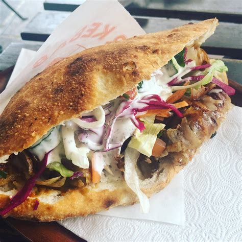 turkish german doner kebab sandwich on homemade bread with chilli and garlic sauce from tonbul