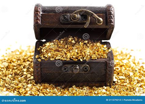 Pieces Of Gold In A Treasure Chest On A White Background Stock Photo