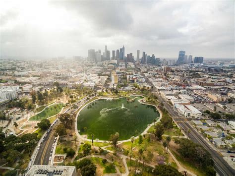 Aerial View Above Of Macarthur Park With Downtown Los Angeles At The